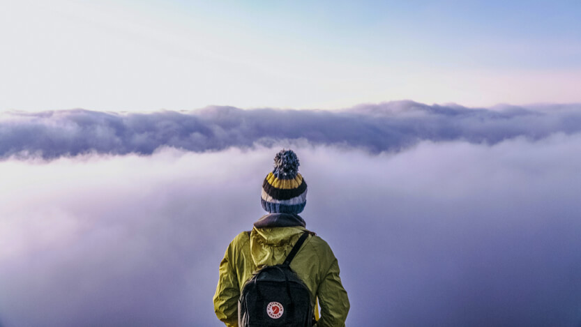 Person looking into clouds